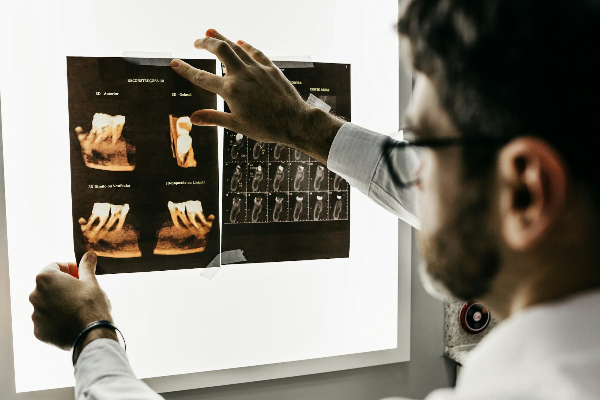 A clinician at Chelsea Dental Studio reviewing detailed dental imaging